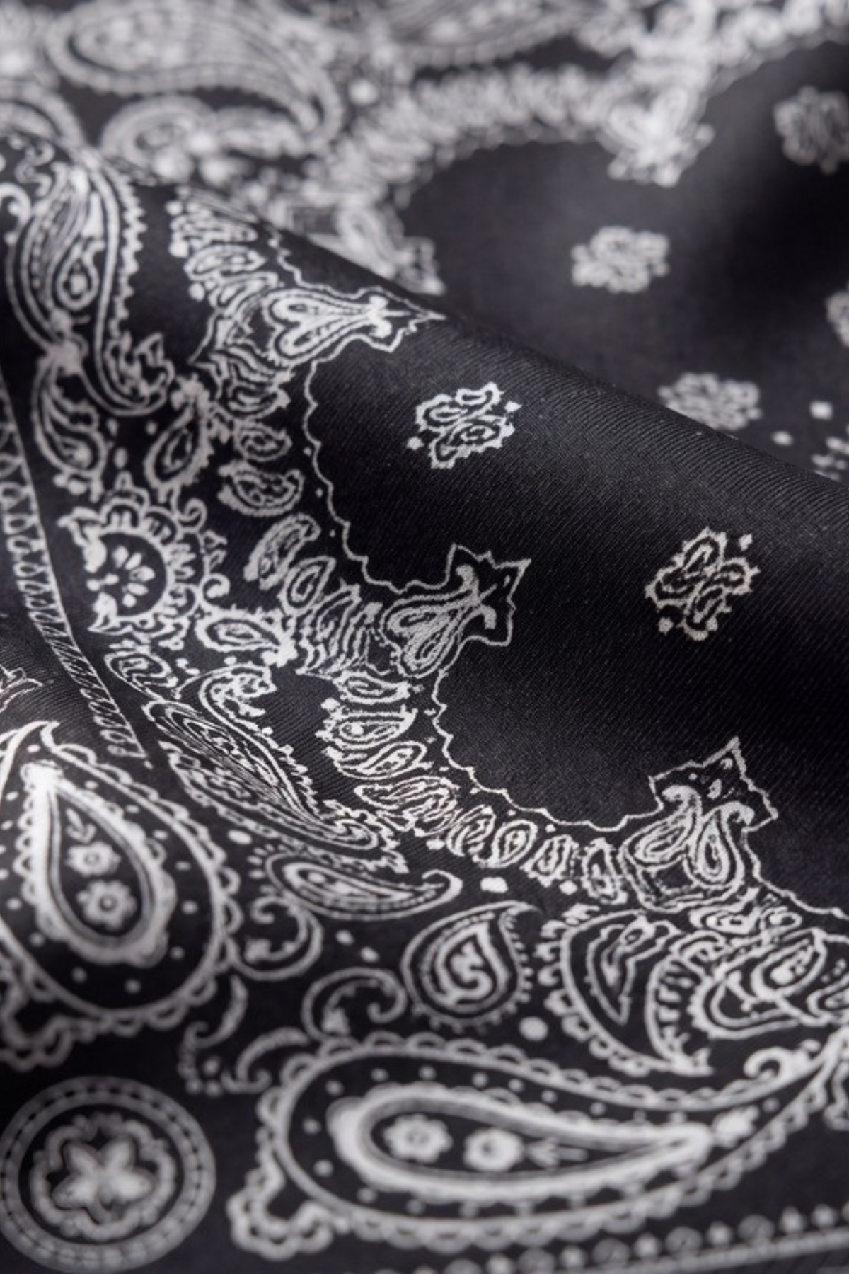 Close-up of the printed silk on the Gatz Kira scarf, showing the weave and print detail