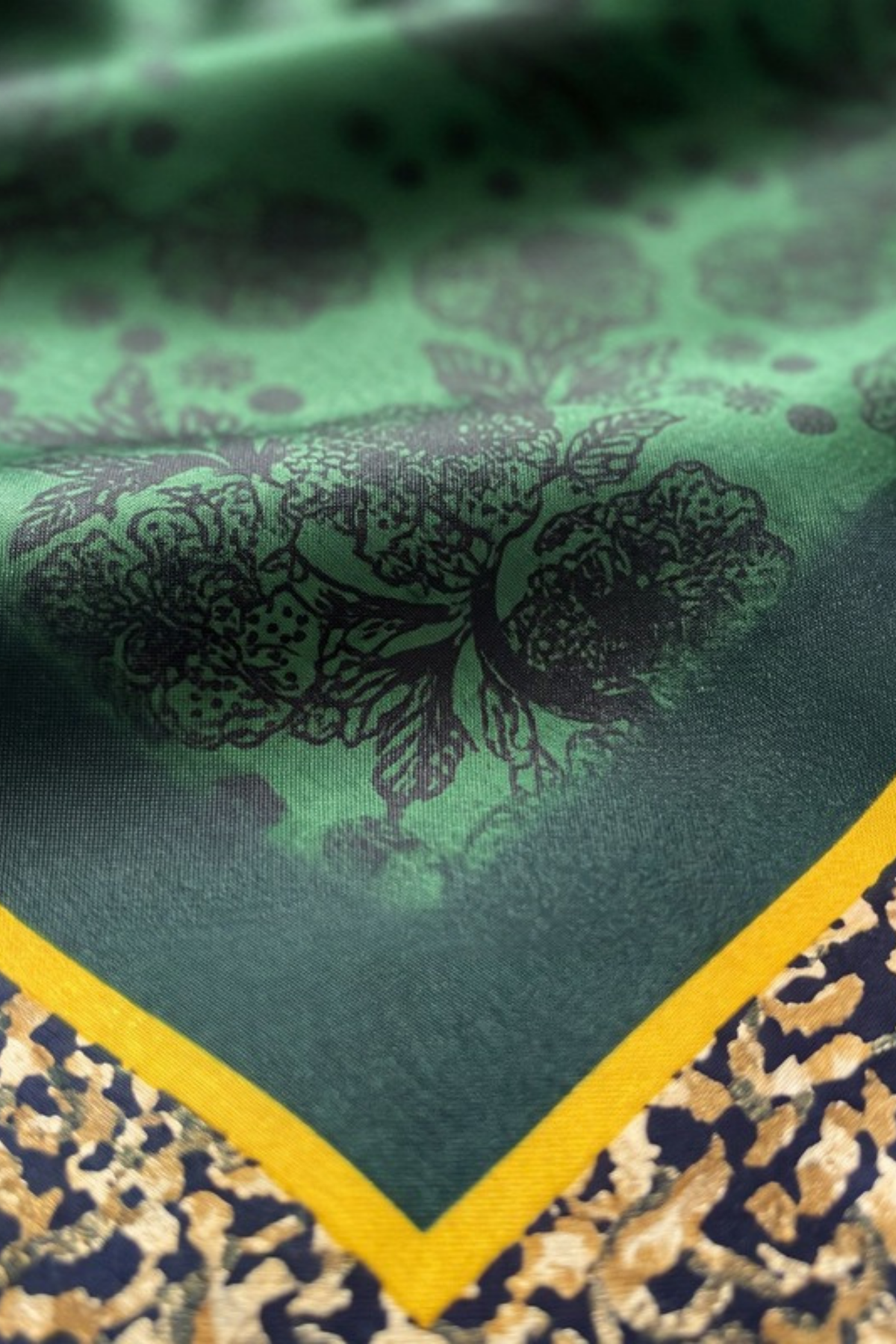 Close-up of the printed silk on the Gatz Daphne scarf, showing the weave and print detail