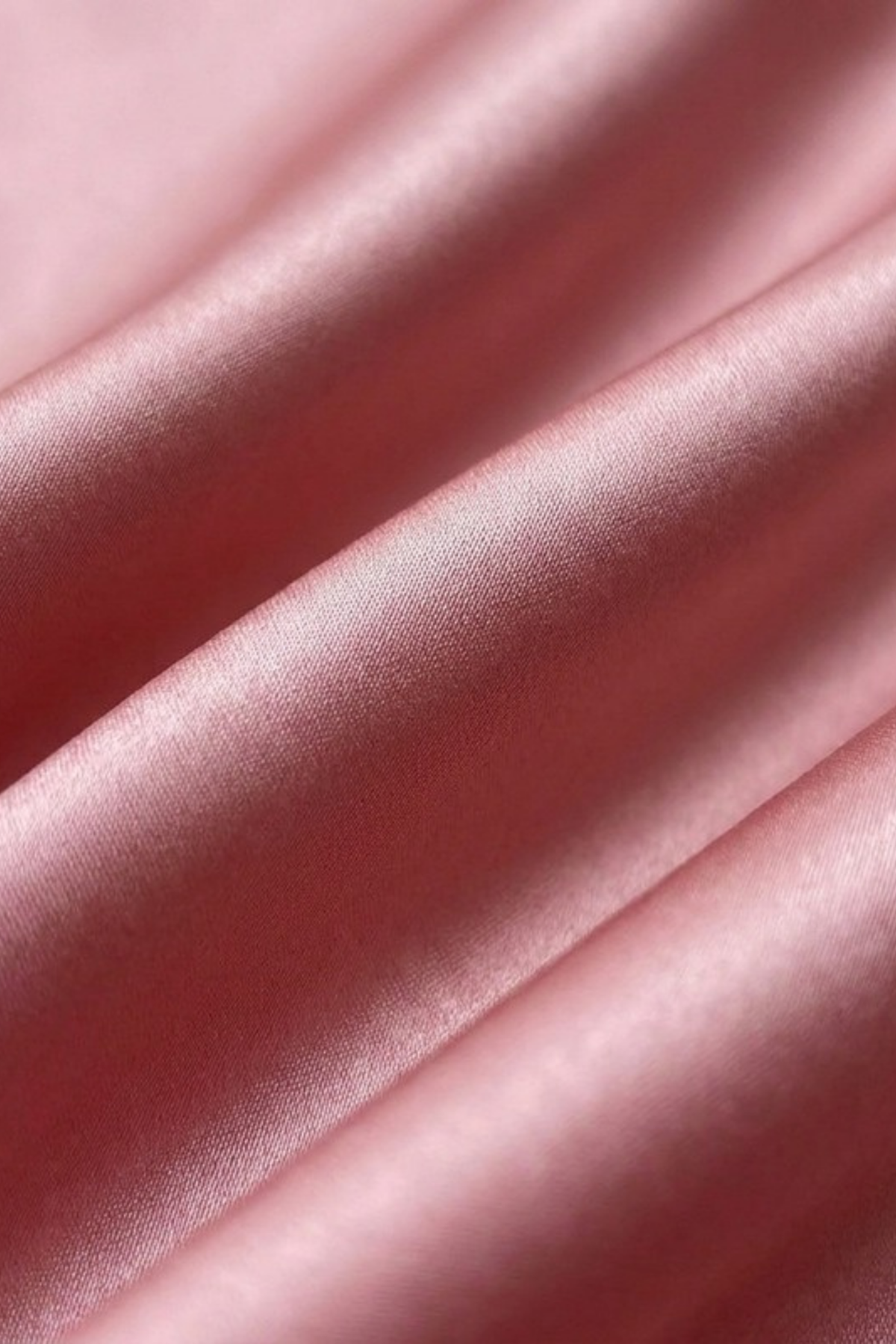 Close-up of the plain dusty-pink silk on the Gatz Caroline scarf, showing the weave and sheen