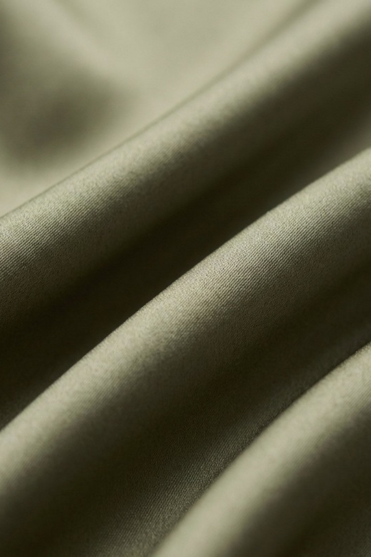 Close-up of the plain olive silk on the Gatz Carolina scarf, showing the weave and sheen