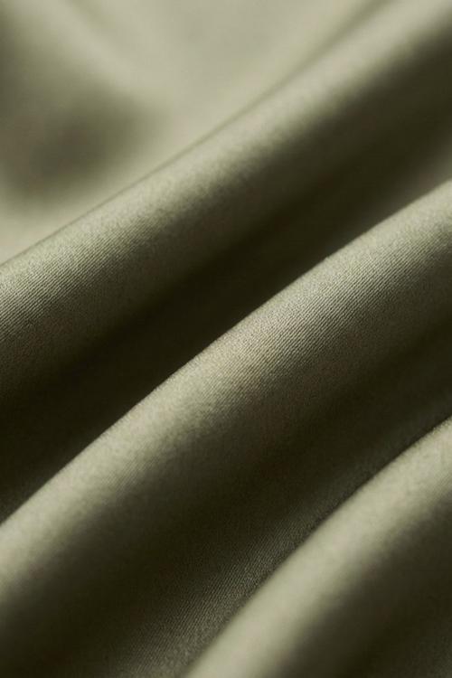 Close-up of the plain olive silk on the Gatz Carolina scarf, showing the weave and sheen